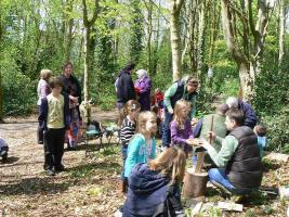 Children learning woodcraft in Angus Wood